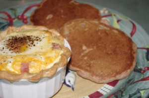 Apple pancakes with apple syrup and egg cup picture