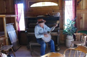 Banjo Piano Man Jay with the banjo at the piano